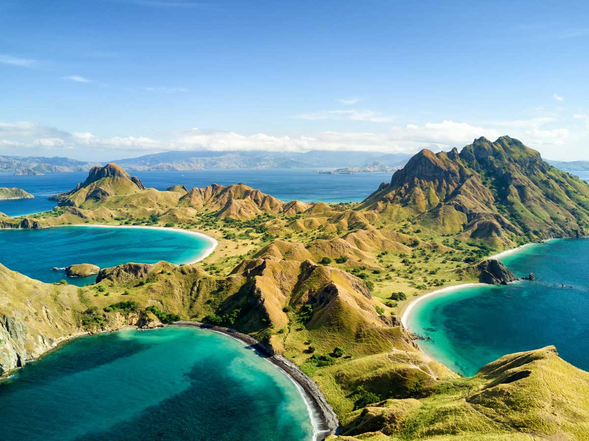 Aerial view of tropical islands with green hills and crescent beaches